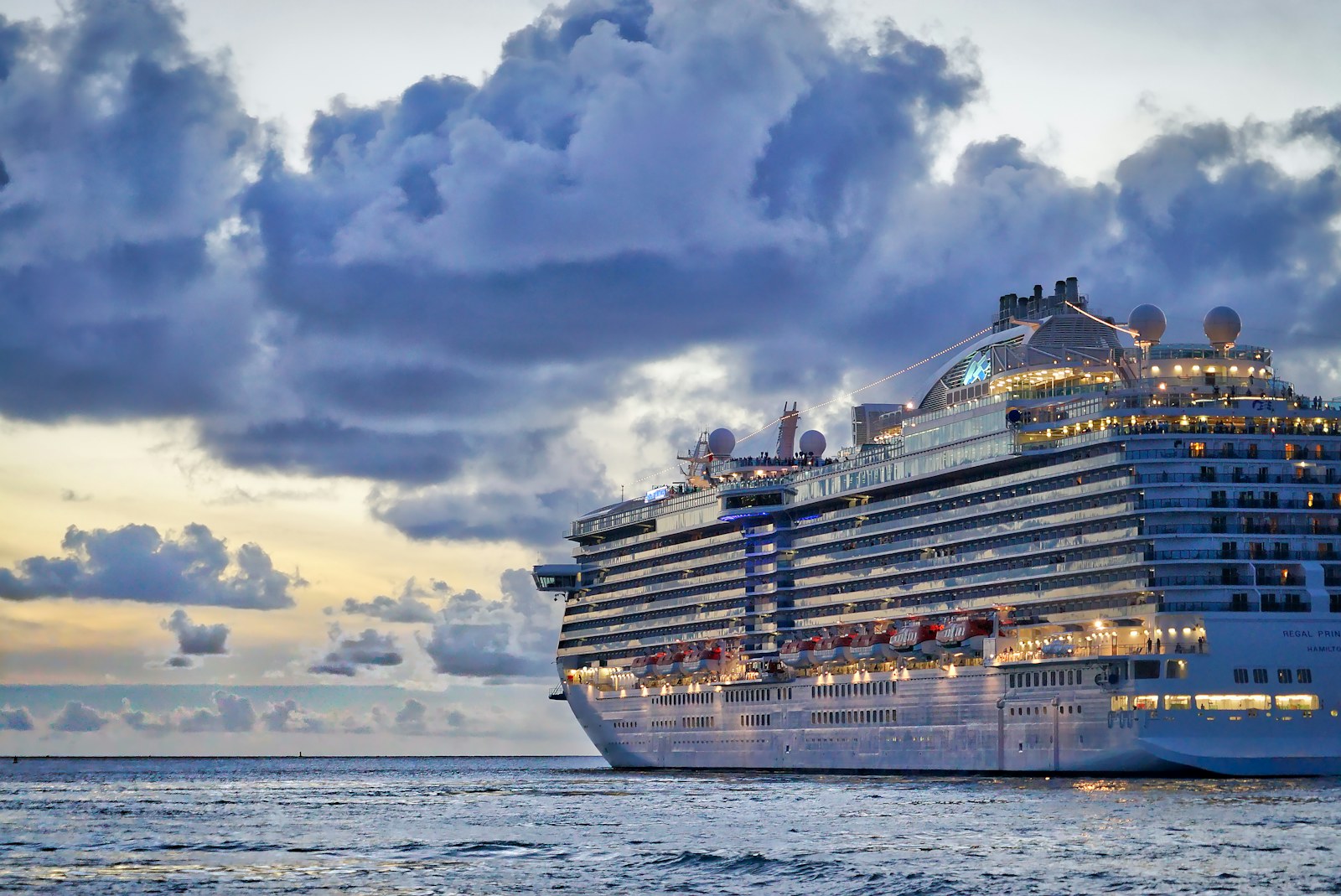Luxury cruise ship sailing at dusk