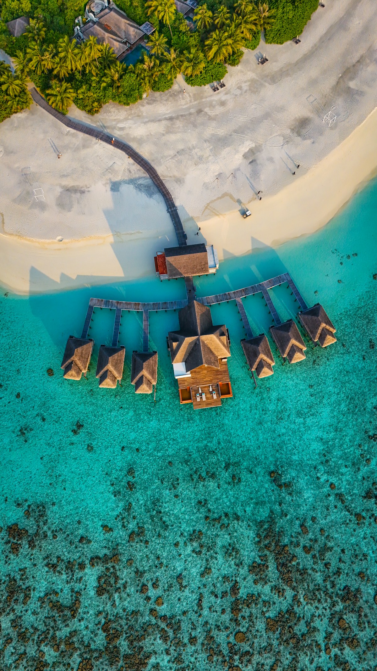 Tropical island resort over turquoise water